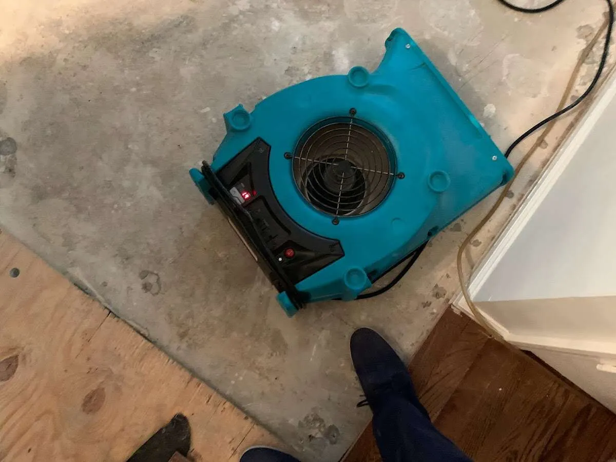 Air mover drying subfloor during Leak Detection & Repair in Aurora